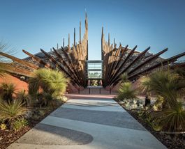 On campus Students walk in front of building one as its tall spires reach for the sky.