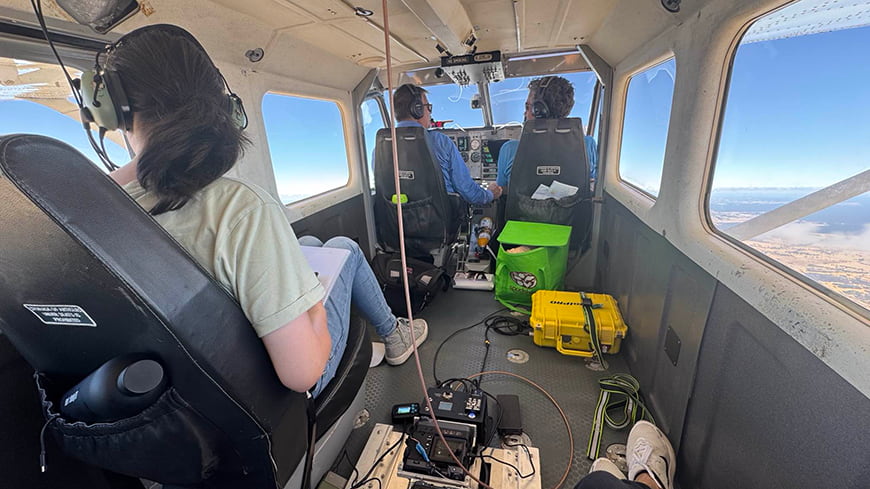 View from inside small plane loaded with infrared camera equipment